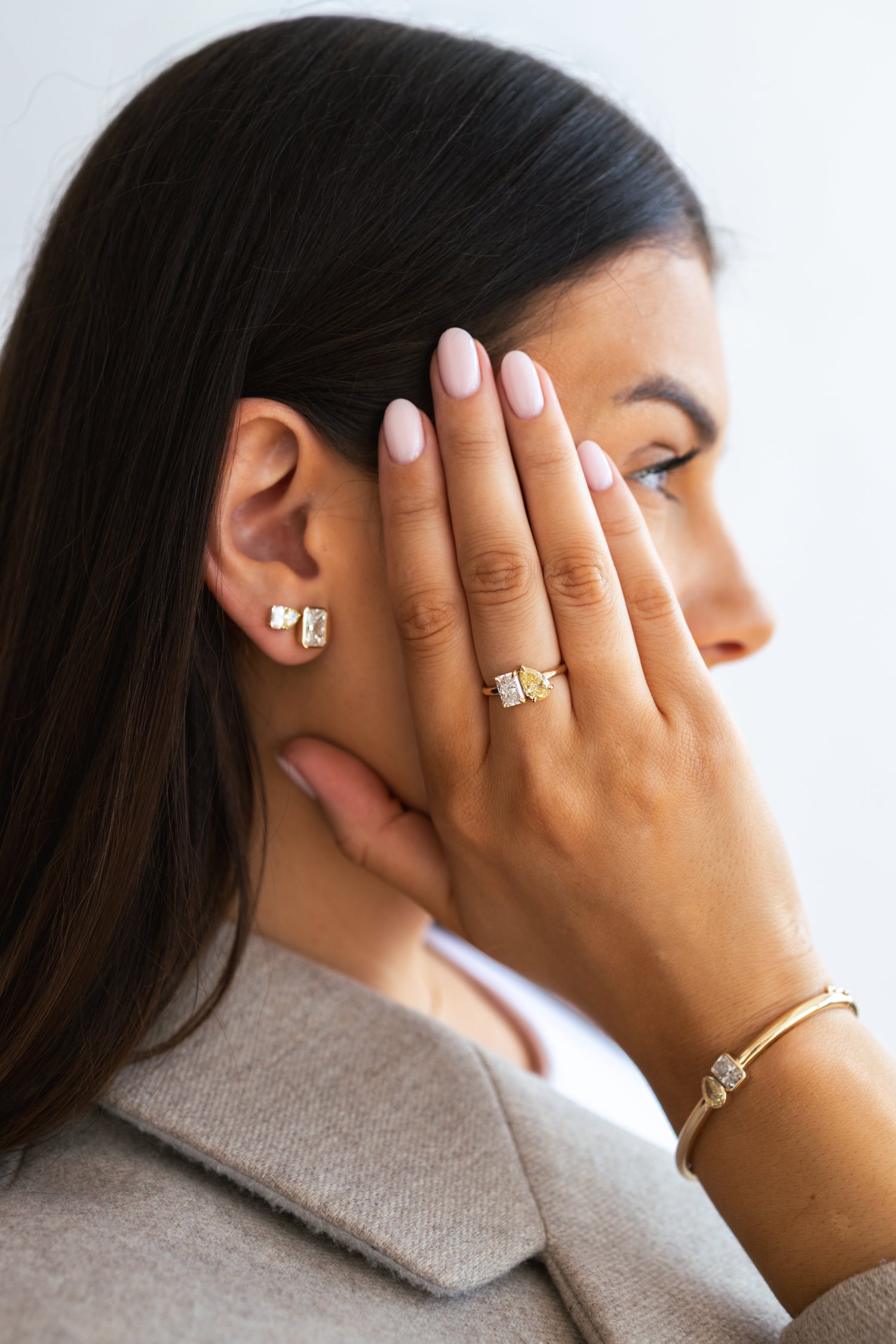 Monique side profile view wearing her jewellery collection